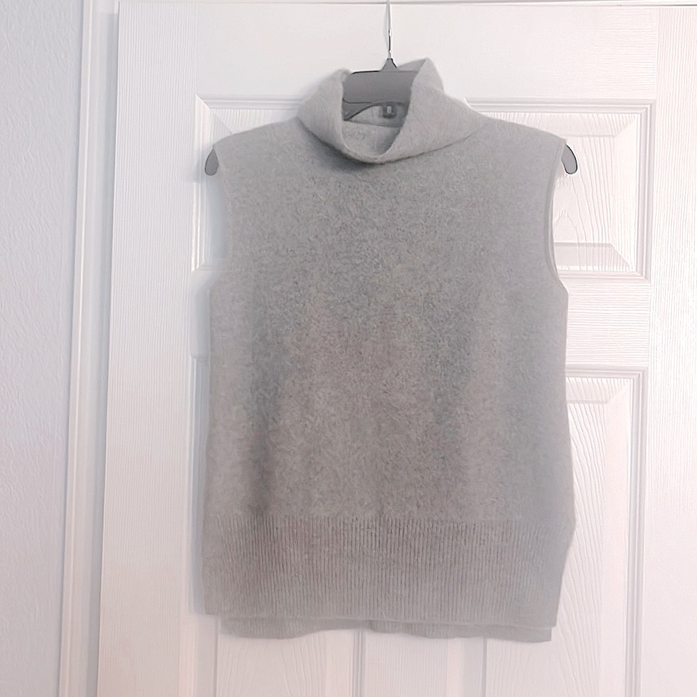 Vince 100% cashmere sleeveless turtleneck with a split hem on the sides